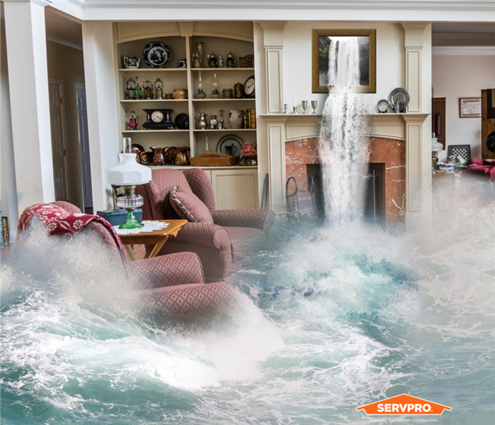 Flooded living room.  Servpro logo